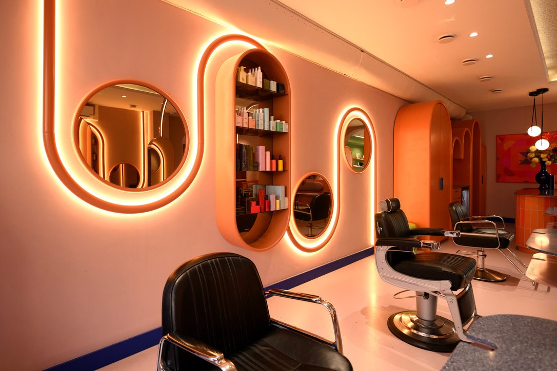 Salon interior with illuminated mirror wall