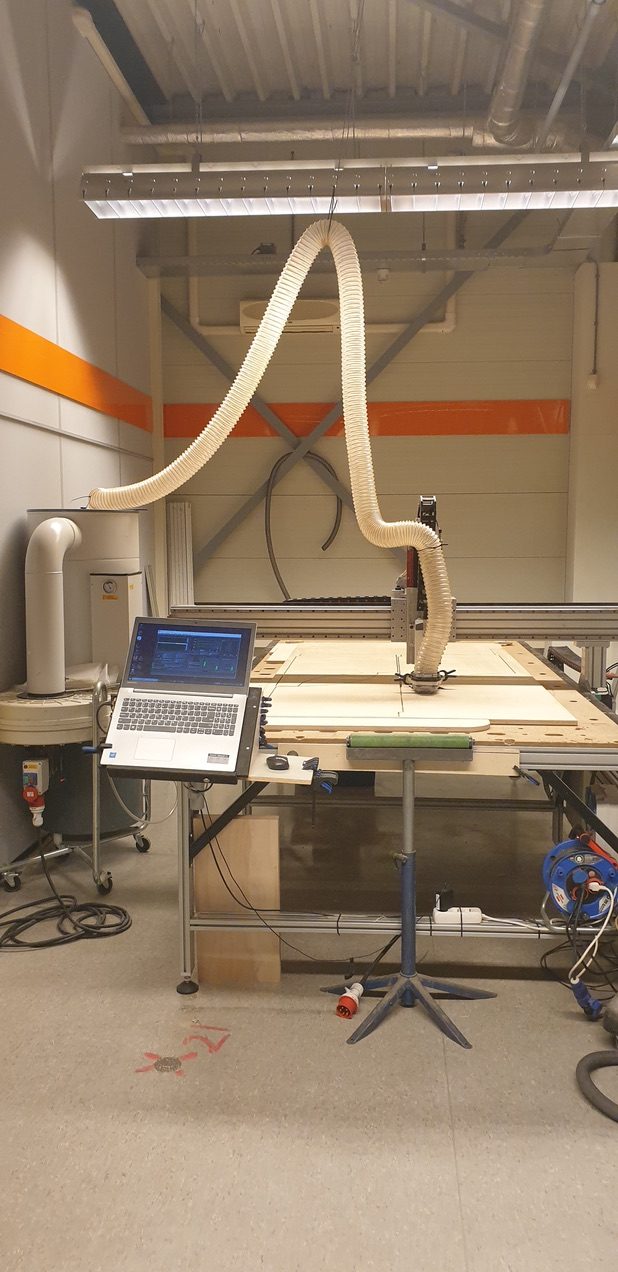 CNC machine running with laptop control station
