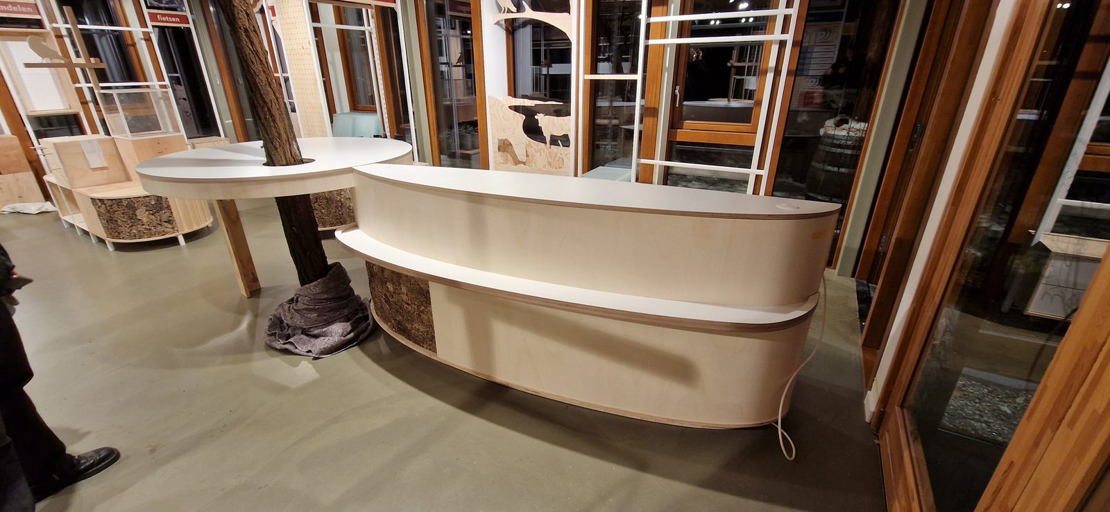 Reception desk with curved cork base detail