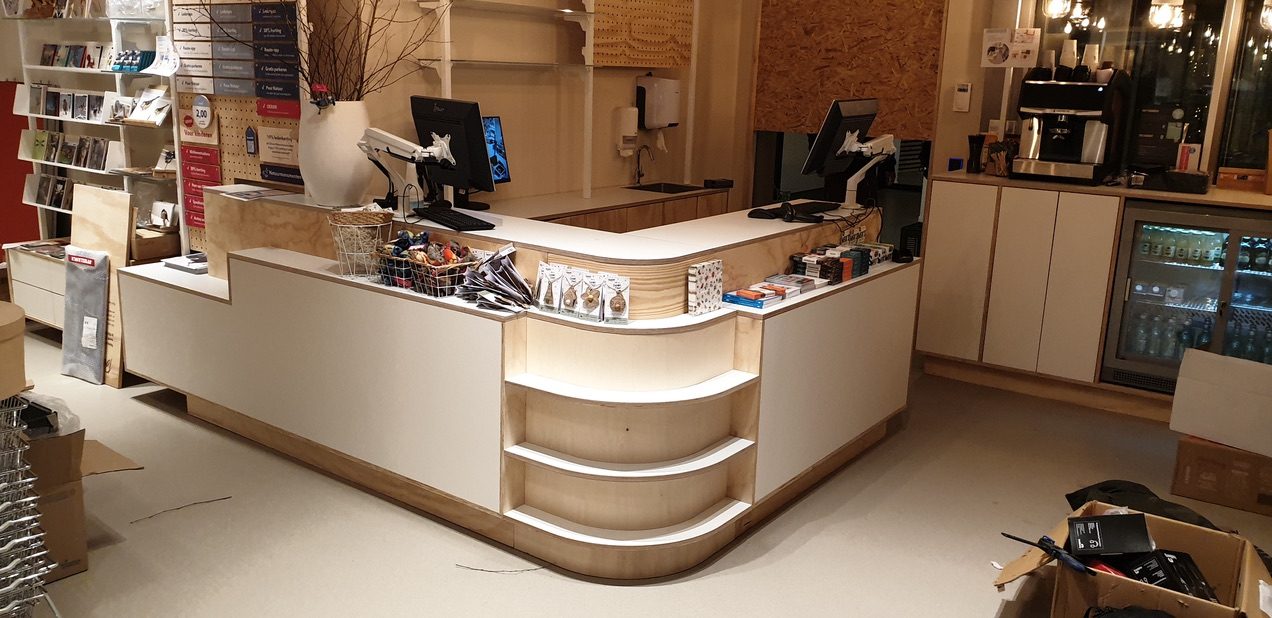 Custom-built reception desk in a retail space
